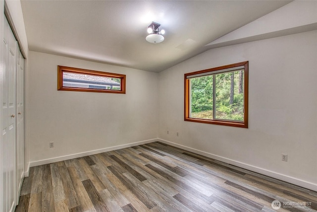 16 Village View Rd, Orcas Island, WA 98245 - empty room featuring lofted ceiling, wood finished floors, and baseboards