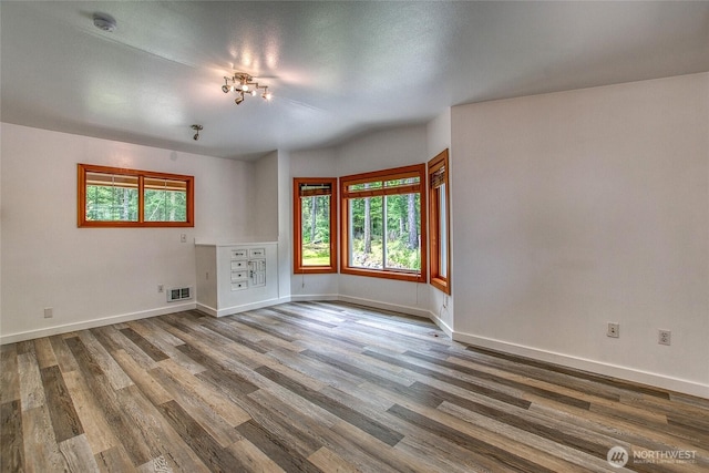 16 Village View Rd, Orcas Island, WA 98245 - unfurnished living room with wood finished floors and baseboards