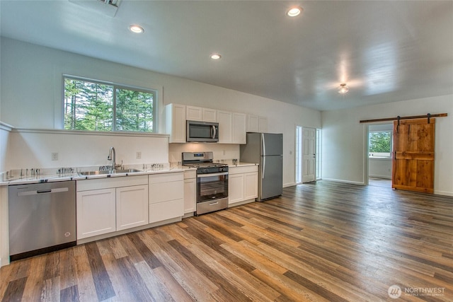16 Village View Rd, Orcas Island, WA 98245 - kitchen featuring stainless steel appliances, a sink, dark wood finished floors, white cabinetry, and recessed lighting