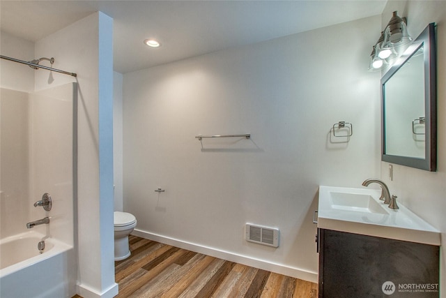 16 Village View Rd, Orcas Island, WA 98245 - bathroom featuring toilet, vanity, wood finished floors,  shower combination, and recessed lighting