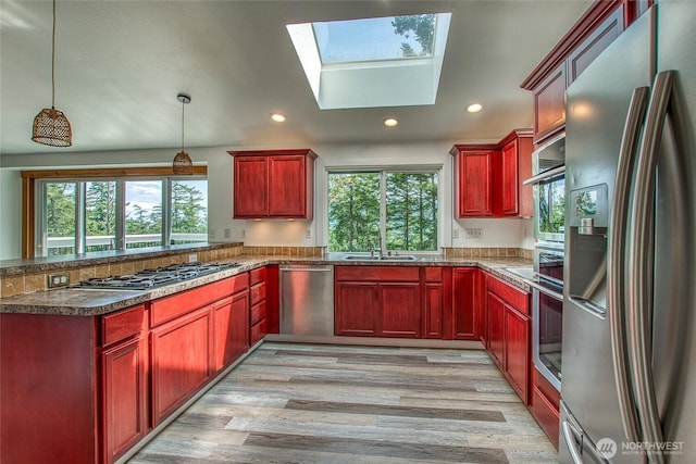 16 Village View Rd, Orcas Island, WA 98245 - kitchen featuring stainless steel appliances, dark brown cabinets, a peninsula, healthy amount of natural light, and recessed lighting