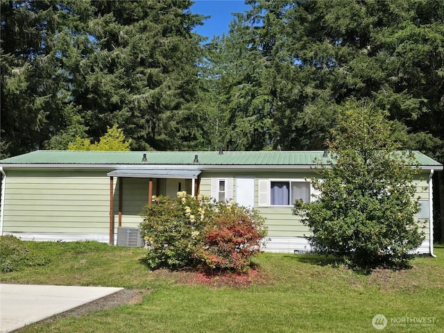 14721 Morris Rd Unit 21, Randle, WA 98377 - view of front of home featuring a front yard, metal roof, and crawl space