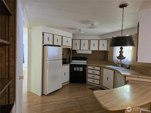 14721 Morris Rd Unit 21, Randle, WA 98377 - kitchen featuring white appliances, wood finished floors, under cabinet range hood, white cabinetry, and a sink