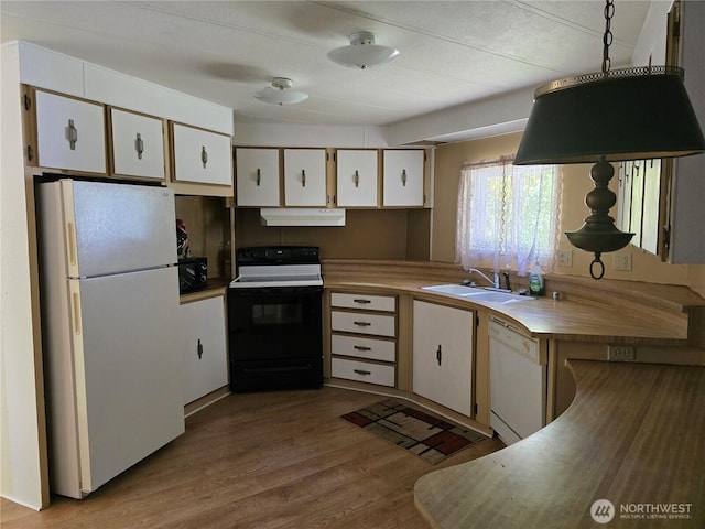 14721 Morris Rd Unit 21, Randle, WA 98377 - kitchen with white appliances, under cabinet range hood, a sink, white cabinetry, and wood finished floors