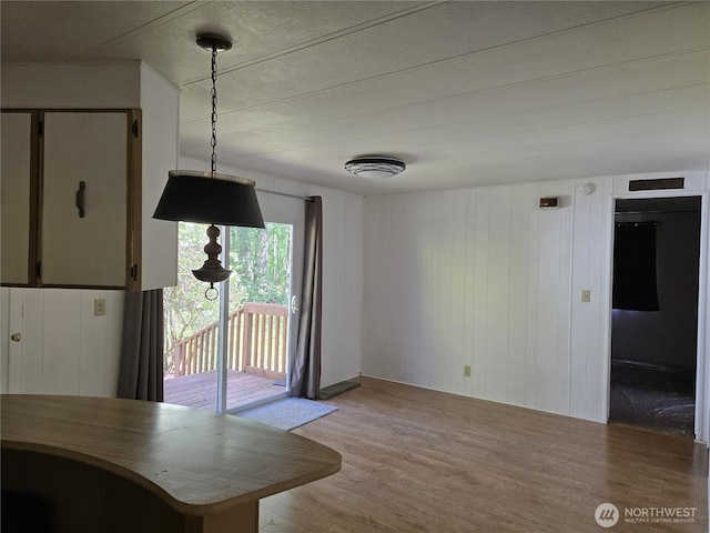 14721 Morris Rd Unit 21, Randle, WA 98377 - dining room featuring wood finished floors and wood walls