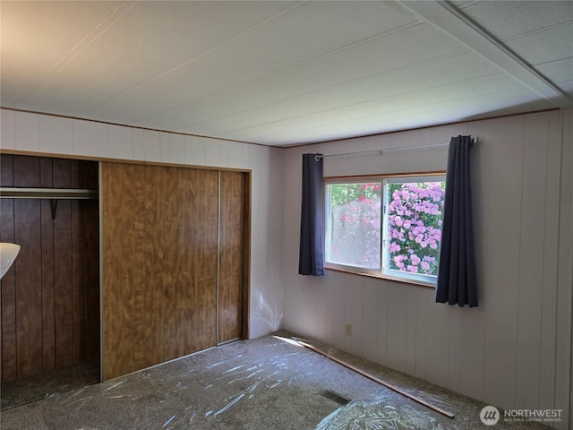 14721 Morris Rd Unit 21, Randle, WA 98377 - unfurnished bedroom featuring a closet and wooden walls
