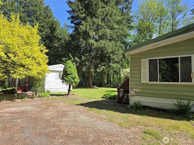 14721 Morris Rd Unit 21, Randle, WA 98377 - view of green lawn featuring an outbuilding
