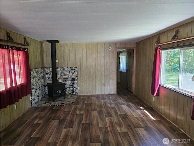 14721 Morris Rd Unit 21, Randle, WA 98377 - unfurnished living room with wood finished floors, a wood stove, and wood walls