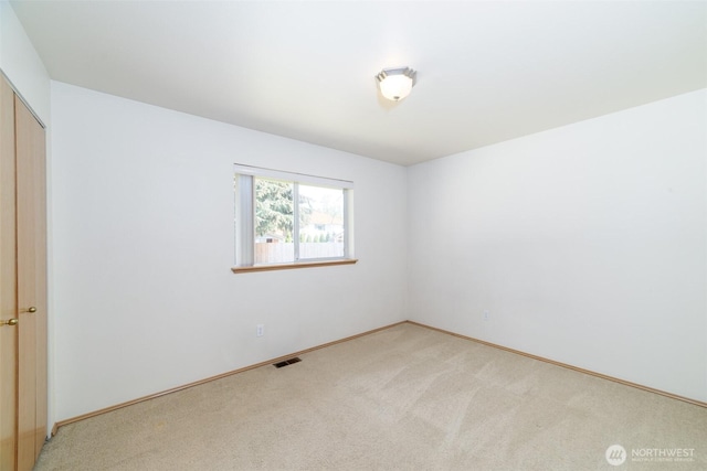 14415 144th St E, Orting, WA 98360 - empty room with light colored carpet and baseboards