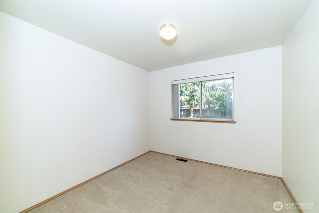 14415 144th St E, Orting, WA 98360 - unfurnished room featuring light colored carpet and baseboards