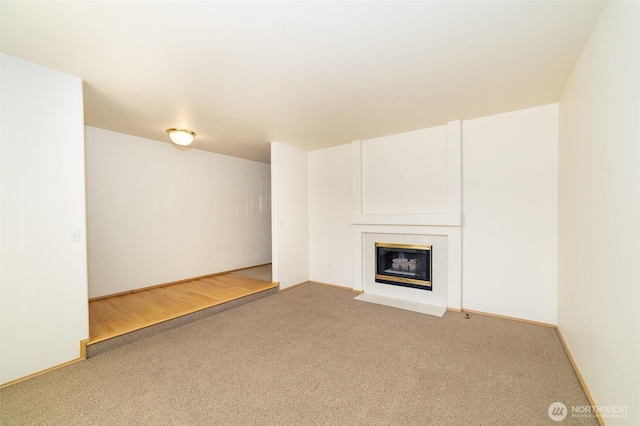 14415 144th St E, Orting, WA 98360 - unfurnished living room featuring carpet and a fireplace