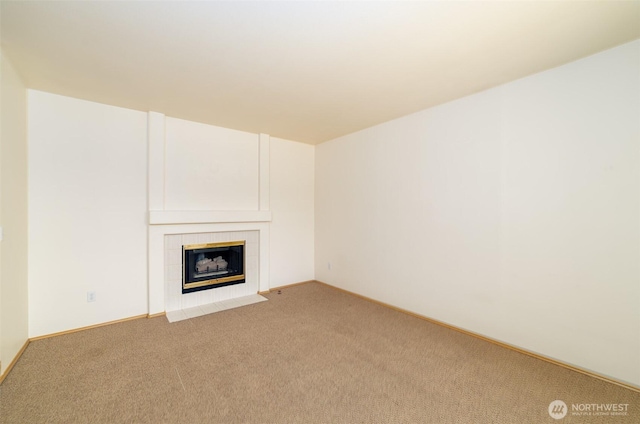 14415 144th St E, Orting, WA 98360 - unfurnished living room with carpet floors, a tile fireplace, and baseboards