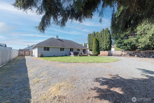 14415 144th St E, Orting, WA 98360 - back of house featuring gravel driveway, a chimney, and central AC unit