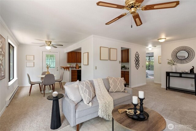 60 E Christmas Tree Pl, Belfair, WA 98528 - living area with a baseboard heating unit, a ceiling fan, light carpet, ornamental molding, and baseboards