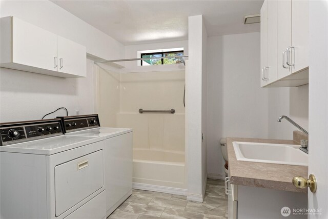 60 E Christmas Tree Pl, Belfair, WA 98528 - laundry room with washing machine and clothes dryer and cabinet space