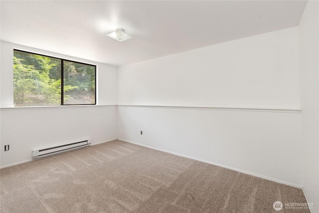 60 E Christmas Tree Pl, Belfair, WA 98528 - carpeted empty room with a baseboard heating unit and baseboards