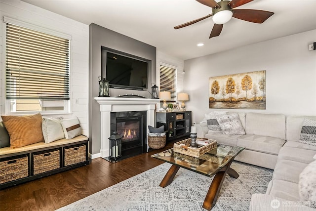 912 77th Dr SE, Lake Stevens, WA 98258 - living room featuring a ceiling fan, wood finished floors, a glass covered fireplace, and recessed lighting