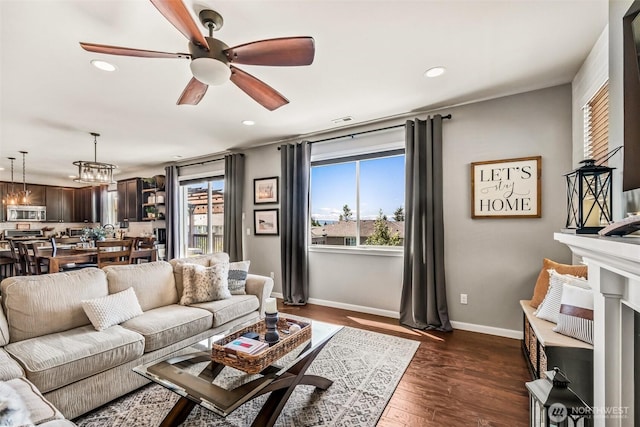 912 77th Dr SE, Lake Stevens, WA 98258 - living room with ceiling fan, recessed lighting, dark wood finished floors, baseboards, and a fireplace