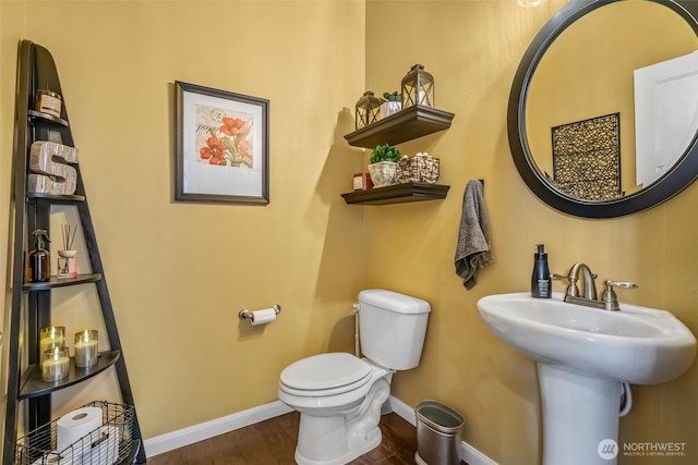 912 77th Dr SE, Lake Stevens, WA 98258 - half bath featuring wood finished floors, baseboards, toilet, and a sink
