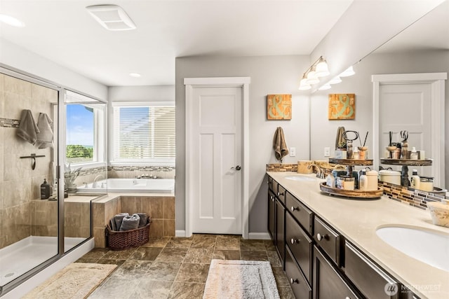 912 77th Dr SE, Lake Stevens, WA 98258 - bathroom featuring a bath, double vanity, a stall shower, and baseboards