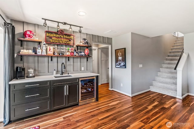 912 77th Dr SE, Lake Stevens, WA 98258 - indoor wet bar with wine cooler, baseboards, and wood finished floors