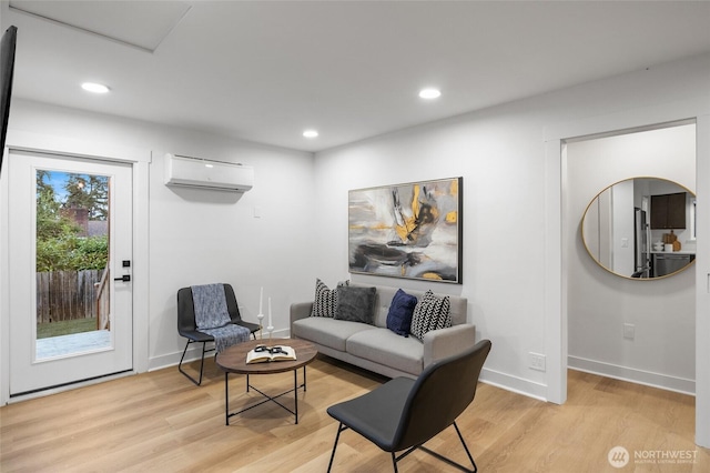 11550 22nd Ave NE, Seattle, WA 98125 - living room with a wall mounted AC, light wood-type flooring, recessed lighting, and baseboards
