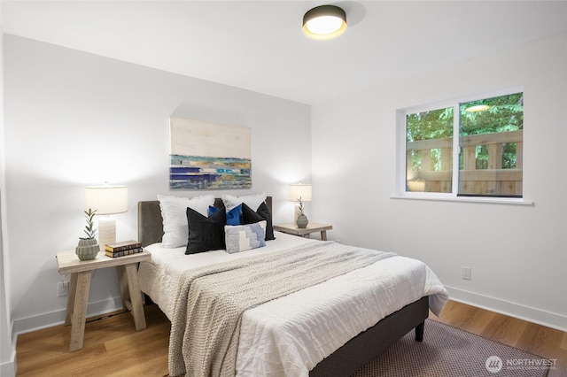 11550 22nd Ave NE, Seattle, WA 98125 - bedroom featuring light wood-style floors and baseboards