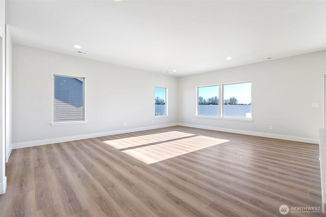 4247 W Sandy Ct, Moses Lake, WA 98837 - unfurnished room featuring wood finished floors, baseboards, and recessed lighting