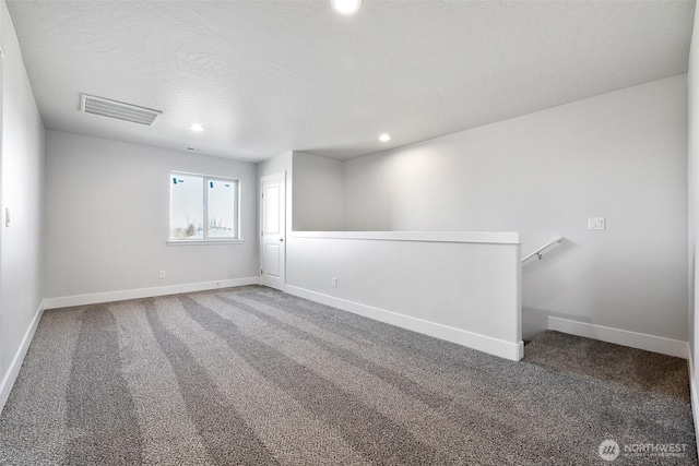 4247 W Sandy Ct, Moses Lake, WA 98837 - carpeted empty room with baseboards and recessed lighting