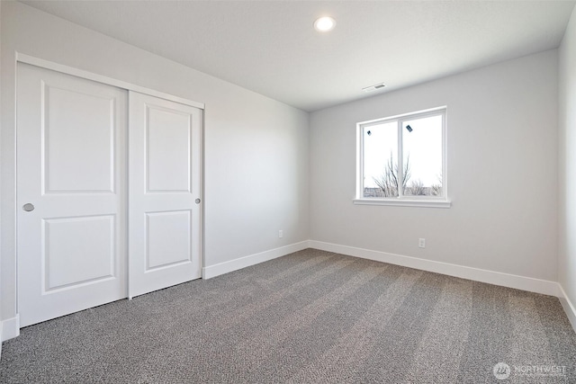 4247 W Sandy Ct, Moses Lake, WA 98837 - unfurnished bedroom featuring baseboards, dark colored carpet, a closet, and recessed lighting