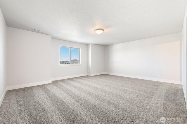 4235 W Sandy Ct, Moses Lake, WA 98837 - spare room with carpet floors, a textured ceiling, and baseboards