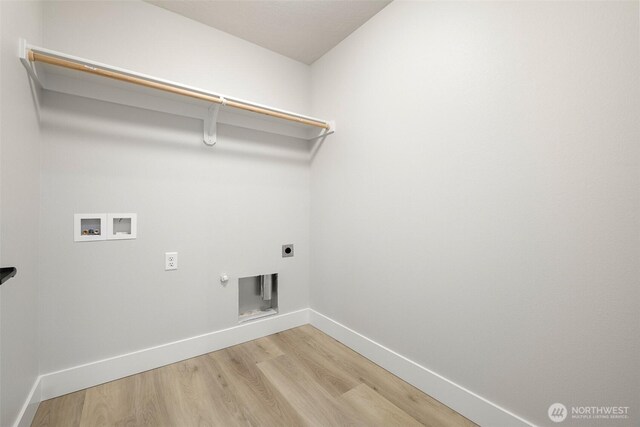 4235 W Sandy Ct, Moses Lake, WA 98837 - laundry room featuring washer hookup, gas dryer hookup, light wood-style floors, electric dryer hookup, and baseboards