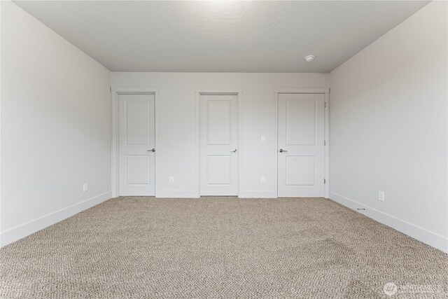 202 N Sandy Loop, Moses Lake, WA 98837 - unfurnished bedroom featuring baseboards and carpet