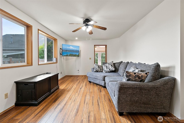 1165 Harding St, Enumclaw, WA 98022 - living area with ceiling fan, light wood-style floors, plenty of natural light, and french doors