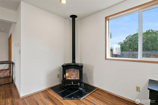 1165 Harding St, Enumclaw, WA 98022 - detailed view of a wood stove, wood finished floors, and recessed lighting