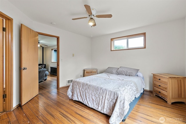 1165 Harding St, Enumclaw, WA 98022 - bedroom featuring light wood-style flooring, a ceiling fan, and baseboards