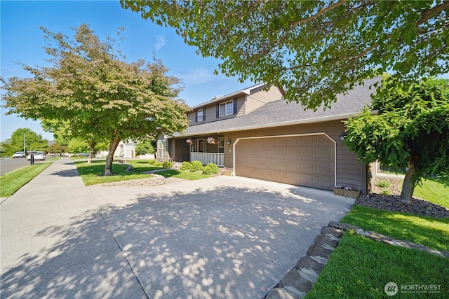 1210 Southview Dr, Walla Walla, WA 99362 - traditional home featuring driveway, an attached garage, covered porch, and a front lawn