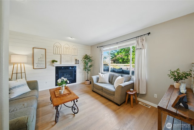 1210 Southview Dr, Walla Walla, WA 99362 - living room with light wood-style floors, a fireplace, and baseboards