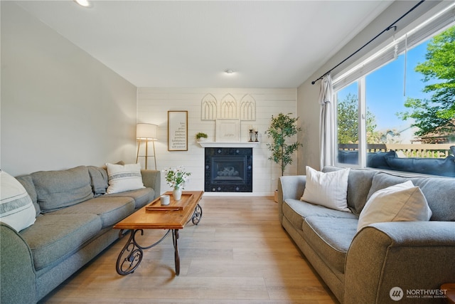 1210 Southview Dr, Walla Walla, WA 99362 - living room featuring light wood-style floors, a glass covered fireplace, and recessed lighting