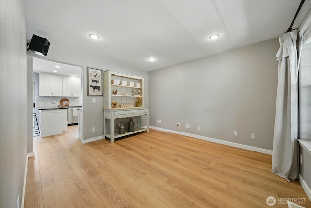 1210 Southview Dr, Walla Walla, WA 99362 - unfurnished living room with light wood-style flooring, recessed lighting, and baseboards