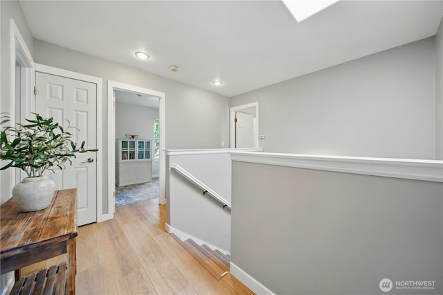 1210 Southview Dr, Walla Walla, WA 99362 - hallway featuring an upstairs landing, light wood-style floors, recessed lighting, and baseboards