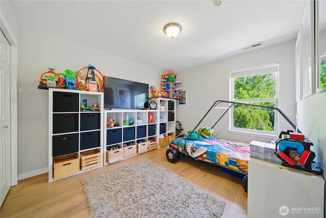 1210 Southview Dr, Walla Walla, WA 99362 - bedroom featuring wood finished floors, a closet, and baseboards