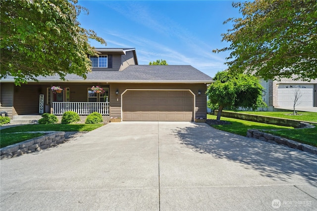1210 Southview Dr, Walla Walla, WA 99362 - view of front facade featuring driveway, an attached garage, a porch, and a shingled roof