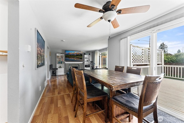 10319 SE 228th St, Kent, WA 98031 - dining space with wood finished floors, ceiling fan, plenty of natural light, and baseboards