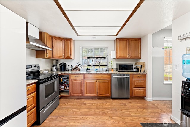 10319 SE 228th St, Kent, WA 98031 - kitchen featuring appliances with stainless steel finishes, wall chimney range hood, a sink, and brown cabinetry