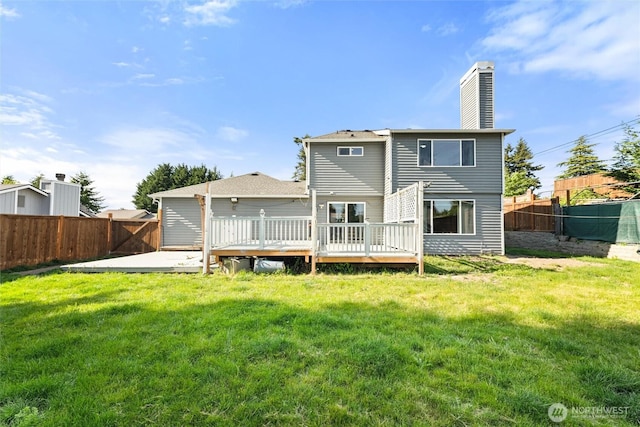 10319 SE 228th St, Kent, WA 98031 - rear view of house with a chimney and a deck