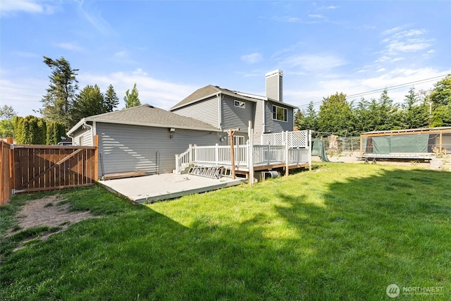 10319 SE 228th St, Kent, WA 98031 - rear view of house featuring a deck and a chimney