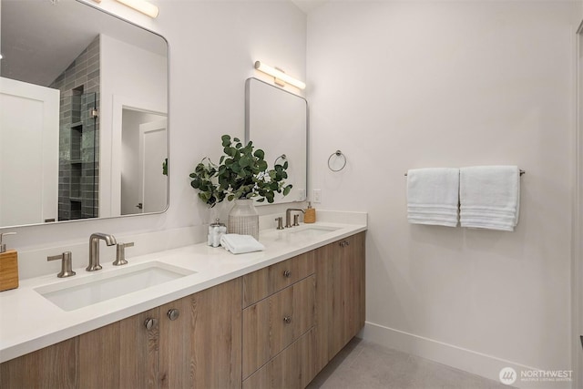 10304 NE 113th Pl Unit B, Kirkland, WA 98033 - full bath featuring double vanity, baseboards, and tile patterned floors