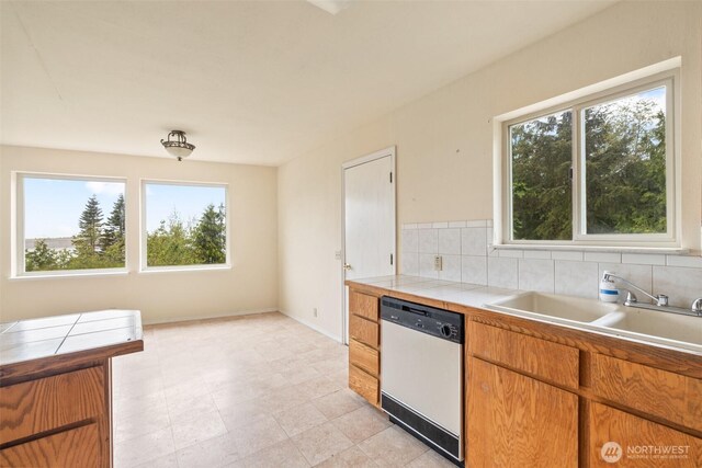 300 N St, Sequim, WA 98382 - kitchen featuring dishwasher, tile counters, healthy amount of natural light, and a sink
