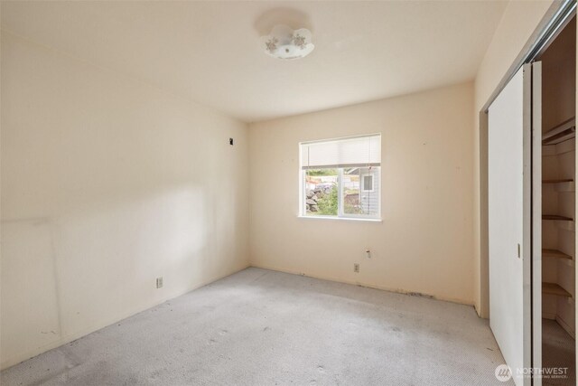 300 N St, Sequim, WA 98382 - unfurnished bedroom featuring carpet flooring and a closet